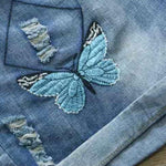 blue butterfly denim shorts