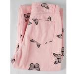 folded pink monarch butterfly pants