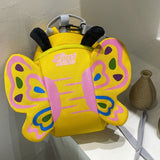 yellow butterfly shaped backpack with wings