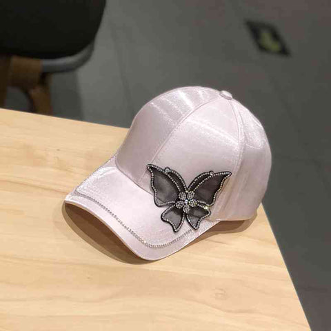 pink abstract butterfly cap