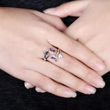 purple butterfly ring on finger