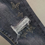 beaded butterfly ripped jeans