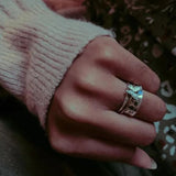 antique butterfly spinner ring on finger