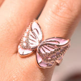 enamel butterfly ring on finger