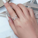 open butterfly ring on finger