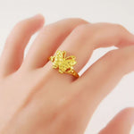 yellow butterfly ring on finger