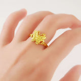 yellow butterfly ring on finger